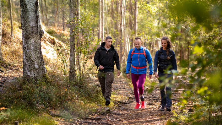 Mattias goes hiking in the woods with two friends.