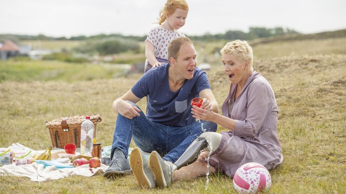 User Jenny having a picnic with her granddaughter. 