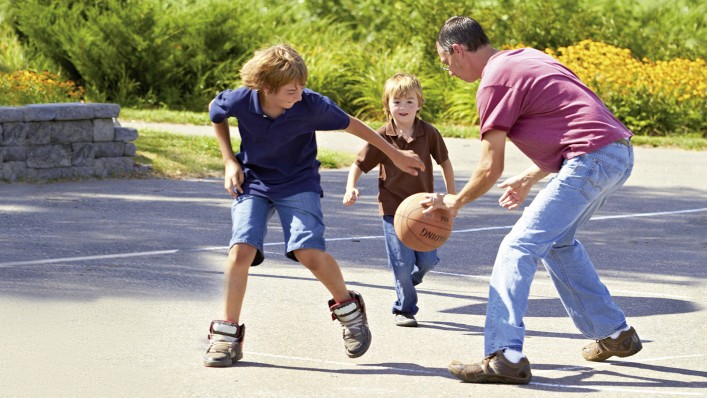 Rick plays basketball with children.