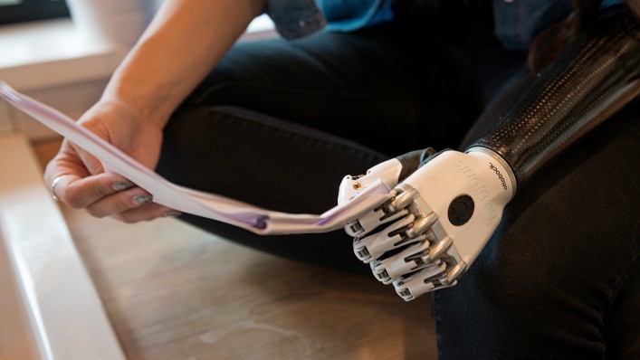 A bebionic user holds a script with the key grip.