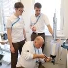 Thomas Pfleghar, O&P professional and Ottobock Technical Director at the Rio 2016 Paralympic Games, works together with two colleagues to repair the socket of an athlete’s leg prosthesis.