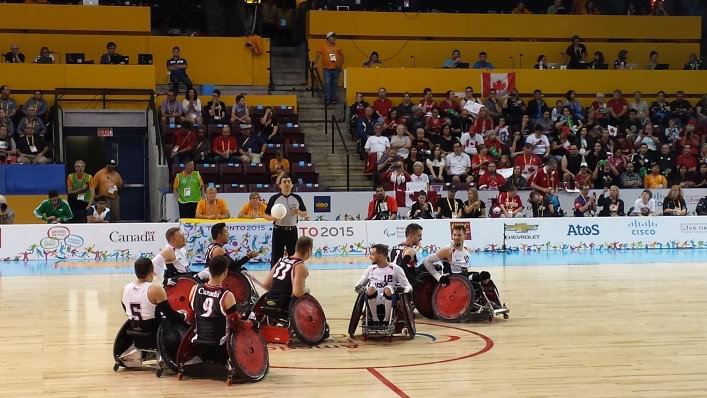 Two teams playing wheelchair rugby
