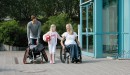 Woman in an Avantgarde wheelchair with her daughter and husband on the way to the gym.