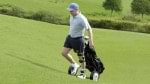 Axel with Free Walk orthosis walking with golf bag