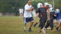 Kevin with C-Leg prosthesis coaching a football team.