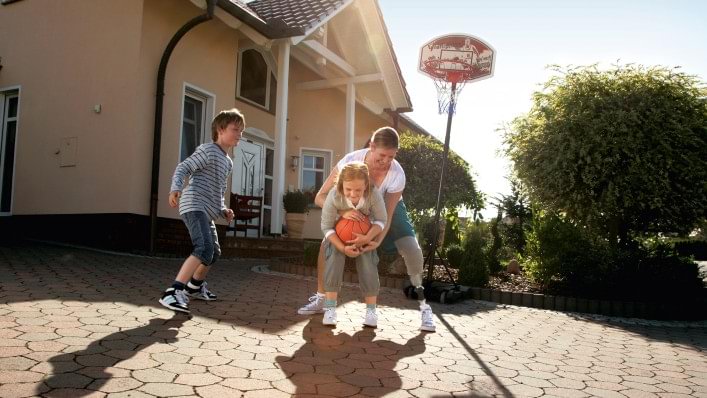 Tanja plays basketball with her children